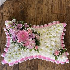 Pillow massed ribbon edged